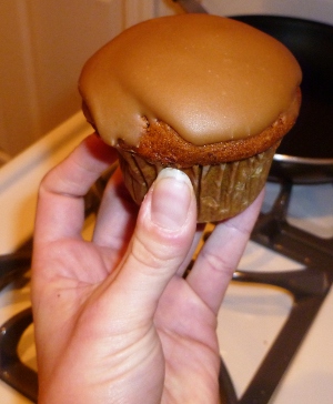 pumpkin cupcake topped with penuche frosting